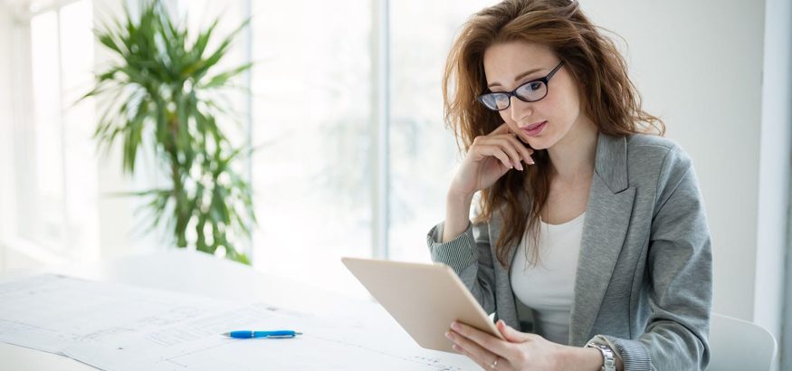 portrait-of-attractive-business-partners-using